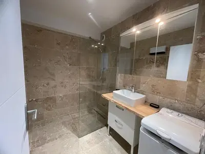 a bathroom with a sink and a shower at La Métairie du Château Paul in Aussillon