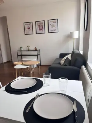 a living room with two plates on a table at Casa Colori - Charmant T2 in Carcassonne