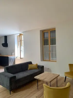 a living room with a couch and a table at Maison de ville centre de Narbonne Amardeil in Narbonne