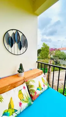 a balcony with a bench and a view of the ocean at Studio Chanzy lumineux cozy avec terrasse Narbonne in Narbonne
