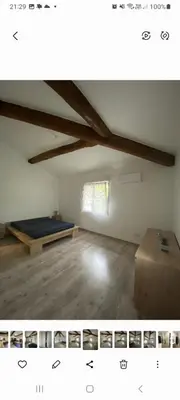 an attic room with a mattress and a bed in it at Agréable maison dans petit village calme in Floure