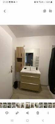 a bathroom with a sink and a mirror at Agréable maison dans petit village calme in Floure
