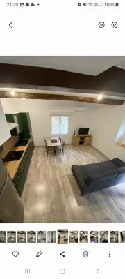 an empty room with a table and a dining room at Agréable maison dans petit village calme in Floure