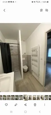 a bathroom with a toilet and a sink and a shower at Agréable maison dans petit village calme in Floure