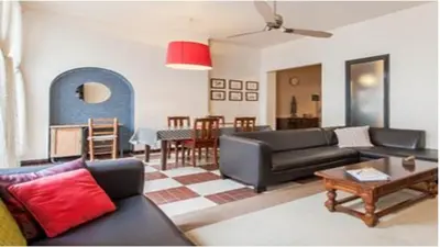 a living room with a couch and a table at Chez Georges in Carcassonne