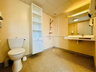 a bathroom with a toilet and a sink at T2 à proximité Grand Buffets in Narbonne