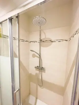 a shower with a glass door in a bathroom at Pipa in Narbonne