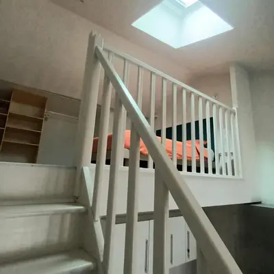 a room with a staircase and a skylight at Pipa in Narbonne
