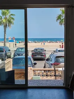 a view of a parking lot with cars parked at Studio SAM - Face à la Mer in Port-la-Nouvelle