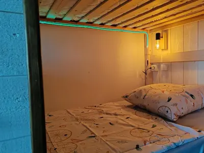 a bunk bed in a room with a pillow on it at Studio SAM - Face à la Mer in Port-la-Nouvelle