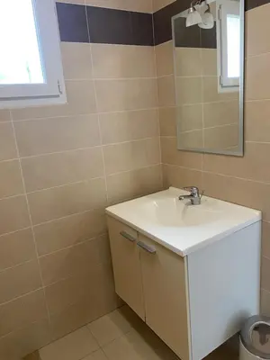 a bathroom with a sink and a mirror at Dépendance paisible in Ventenac-Cabardès