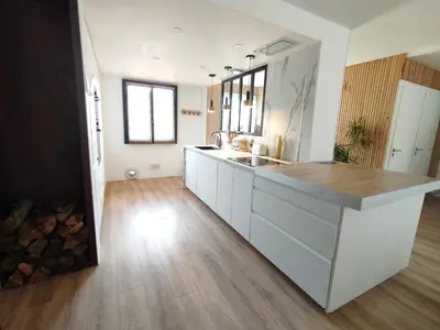 a kitchen with a sink and a counter top at La maison des moments in Carcassonne
