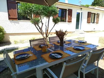 a blue table with plates and napkins on it at La maison des moments in Carcassonne
