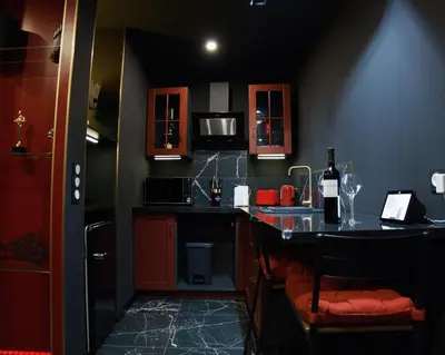 a small kitchen with a counter and a sink at Studio Cinéma privé Centre ville & King size in Narbonne