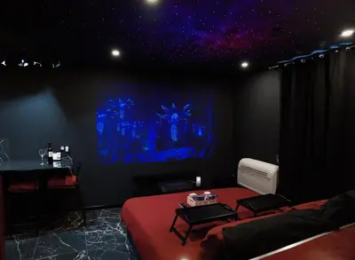 a room with a room with a bed and a table at Studio Cinéma privé Centre ville & King size in Narbonne