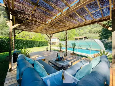a bedroom with a wooden bed and a window at Peaceful Retreat At The Foot Of Black Mountain in Caunes-Minervois
