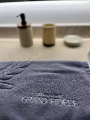 a blue towel with the words grandbilt on it at Villa Les Charmes in Narbonne