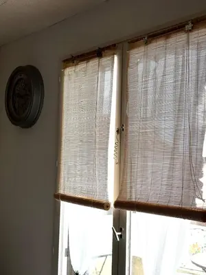 a window with blinds in a room with a window at Appartement T2 in Port-la-Nouvelle