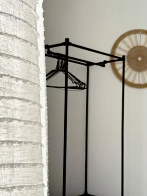 a clock on a wall next to a white wall at Appartement T2 in Port-la-Nouvelle