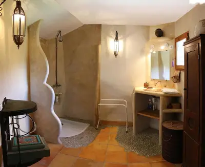 a bathroom with a shower and a sink at La Terrasse aux citronniers in Saint-Vincent