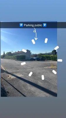 a parking lot with white lines on the road at Chambre Studio B&B in Mazamet
