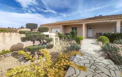 a house with a garden in front of it at Nice Home In Cessenon Sur Orb - Flh677 in Cessenon