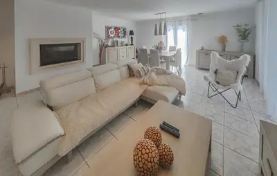 a living room with a couch and a table at Nice Home In Cessenon Sur Orb - Flh677 in Cessenon