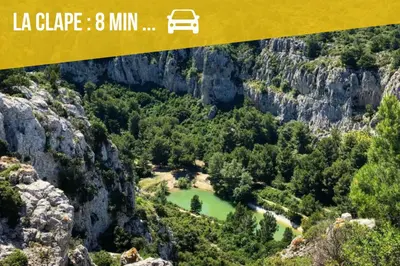 an overhead view of a mountain valley with a green lake at Spacieux appartement Coeur du Village Wifi Draps in Gruissan