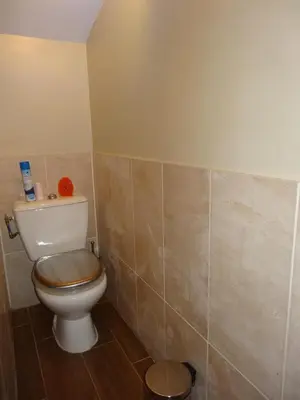 a bathroom with a toilet in a room at Apartment with large terrace, ground floor in Narbonne