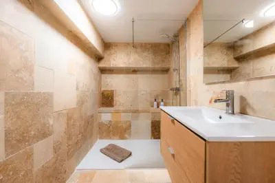 a bathroom with a tub and a sink and a shower at Ambiance sudiste , piscine, boule, farniente AG in Carcassonne
