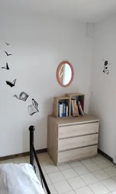 a bedroom with a dresser and a mirror at Chez Rosa in Pradelles-Cabardès