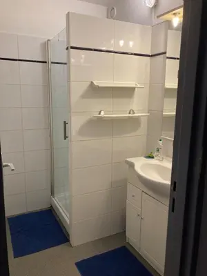 a bathroom with a shower and a sink at Grand T2 à Gruissan, calme, vue sur le port in Gruissan