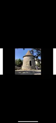 a small stone building with a window in it at Apparemment Résidence la palmeraie in Lapalme
