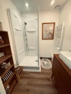 a bathroom with a shower and a sink at Maison de charme in Fontrieu