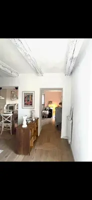 a living room with a couch and a table at Maison de charme in Fontrieu