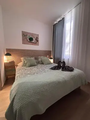 a room with a bed with two towels on it at La Jade in Narbonne