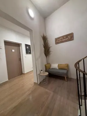 a staircase in a house with white walls at La Jade in Narbonne