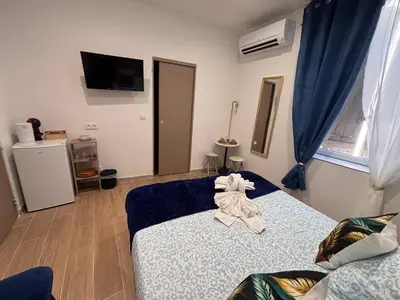 a room with a bed with a towel on it at La Saphir in Narbonne