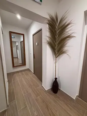 a hallway with a vase with a plant in it at La Saphir in Narbonne