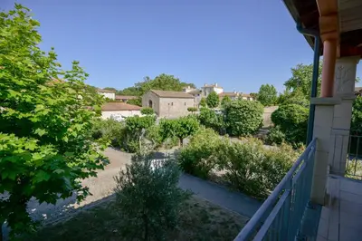 a view of a garden from a balcony of a house at La Résidence du Château de Jouarres in Azille