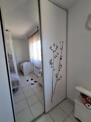 a bathroom with a door with a dandelion sticker on it at Family villa in Salles-d'Aude in Salles-dʼAude