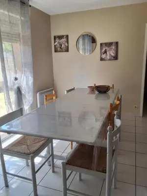 a dining room table with two chairs and a bowl on it at Family villa in Salles-d'Aude in Salles-dʼAude