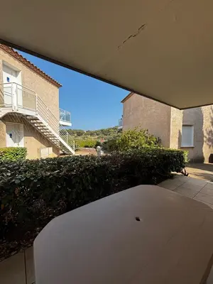a view from a balcony of a building at Résidence Les jardins du Phoebus Géolia Piscine Climatisation Parking By LCG in Gruissan