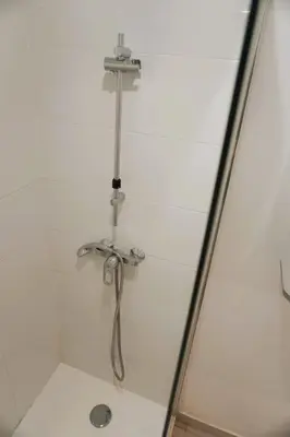 a shower with a faucet in a bathroom at La Dorade du port in Port-la-Nouvelle