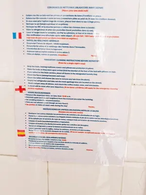 a white document hanging on a wall at L'anguille du port clim jardin mer in Port-la-Nouvelle