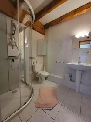 a bathroom with a shower and a sink and a toilet at maison de campagne in Le Vernet