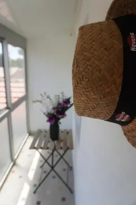 a hat is hanging on a wall in a room at Le Dauphin du port in Port-la-Nouvelle