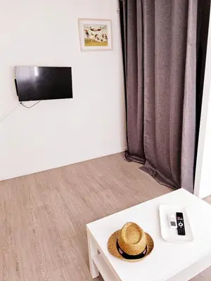 a hat sitting on a table in a living room at L'espadon du port, air conditioning, terrace, sea, 5 people in Port-la-Nouvelle