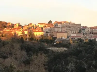a group of buildings on top of a hill at les gites de KALY in Bélesta