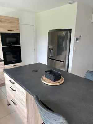 a kitchen with a counter with a basket on it at David in La Tour-du-Crieu